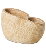 At once modern and organic in nature, the Light Carved draped vase is sculpted and carved by hand in honey-colored mango wood to achieve a distinct artisan feel. A uniquely bold statement by Donna Karan Lenox.