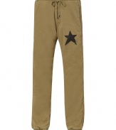 Laid back looks get an ultra cool edge in Jet Sets sporty star print pants, detailed with elasticized cuffs and a drawstring waistline for that effortless rugged edge - Drawstring waistline, side slit pockets, back patch pockets, star print on thigh, fine ribbed cuffs - Casual, baggy fit - Wear with cozy flannels and shearling-lined weather boots