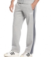 Whether you're ready to run or kick back and lounge, these fleece track pants from adidas will keep you at ease.