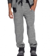 Sean John track pants with the kind of luxe detailing-contrast ribbing, slanted pocket openings, zipper closures-that make them simply extraordinary.