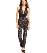 Stunning. Striking. Sexy. Make those statements and more in BCBGMAXAZRIA's sultry lace jumpsuit, featuring a deep, dramatic neckline and banded waist.