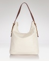 Practical style proves poised with this leather hobo from Tory Burch. In a timeless shape and neutral shade, it's a versatile choice for the day-to-day essentials.