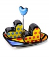 A lot to love, Heart salt and pepper shakers are shaped by the vivid colors and bold patterns of world-renowned pop artist Romero Britto. Spotted shakers are set in a heart-shaped dish to really spice things up.