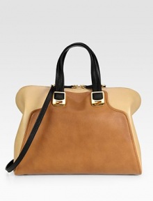 An impeccably tailored silhouette of supple colorblock leather, finished with dual straps for versatility.Double top handles, 5½ dropDetachable adjustable shoulder strap, 18-24½ dropTop zip closureProtective metal feetOne inside zip pocketTwo inside open pocketsCotton lining15W X 11H X 6½DMade in Italy