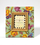 Exuberant flowers in a mini size are a lovely way to frame a favorite face. Floral design on enameled steel Gilt inner molding Glass Accommodates a 2½ X 3 photograph Imported 
