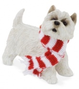 A fetching gift for animal lovers, the Westie Christmas ornament depicts the friendly white pup waiting patiently for treats and dressed in a holiday scarf. From Sandicast.