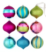 Catch a break with shatterproof ornaments from Kurt Adler. Fun neon colors and graphic glitter motifs make this playful set of drops and balls a favorite new addition to your tree.