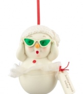 Ready for her closeup, the Hollywood baby snowman slips on evergreen-tinted shades for a bit of holiday drama. A knitted cap completes her chic look from Department 56.