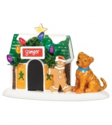 Ginger gets a decked-out doghouse for the holidays, complete with Christmas cookie accents, colored lights and garland. A must for the pet owners of Snow Village, from Department 56.