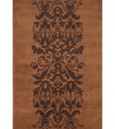 Play with patterns! Wake up your decor with Momeni's irresistibly contemporary rug. A vintage-inspired motif of plumes and blooms adorns this brown wool rug, hand-tufted for texture and superior softness.