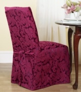 An effortless update and perfect furniture protector, the printed Scroll dining room chair cover from Sure Fit features a draped skirt with back ties for a sleek fit over any style furniture.