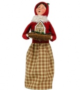 Start every holiday season on a sweet note. This rosy-cheeked woman is bundled tight, caroling door to door and delivering yummy treats with the rest of the Gingerbread Family figurines, all handcrafted by Byers' Choice.