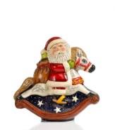 Dressed in traditional red coat and hat, this modern-day Santa sits upon a toy rocking horse with his bag of presents, ready to deliver to all the anxious children. Shaped in an antique chocolate mold, this figurine is then hand painted for one-of-a-kind character. From Vaillancourt.