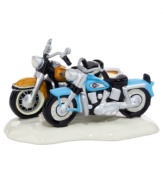 Nice ride. A couple of hogs parked outside Snow Village's Harley-Davidson Road House are the envy of everyone driving by. A figurine for bikers, from Department 56.