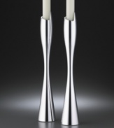 This dramatic candlestick pair adds contemporary flourish to the table. Crafted of Nambé metal alloy that has the heft and shine of solid silver but won't tarnish. Measures 9.