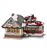 Bikers warm up and gear up for the holiday season at the Harley Road House Cafe. A bike on the roof and festive trim call to everyone in the fun-loving town of Snow Village. From Department 56.