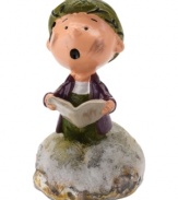 A mess even on Christmas, Pig-Pen sings his heart out, reciting beloved holiday carols in this comical figurine from Peanuts Village. By Department 56.