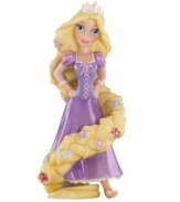 Get tangled up with Disney Pixar's fun and feisty damsel, Rapunzel. Painted in beautiful color, this porcelain ornament from Lenox makes the perfect gift.
