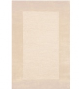 A looped center of mottled tones is framed by rich color in tufted pile, presenting a modern area rug that is both casual and practical. Hand tufted in India of pure wool fibers, the Madrid area rug is a comforting, stylish addition to any decor.