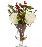 A fresh bouquet without the fuss. White roses and holiday greenery in a simple urn provide long-lasting, family-friendly cheer from one year to the next.