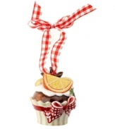 Something to savor around your table and tree, this Winter Bakery cupcake ornament is decorated with snow-white icing, star anise and orange. Hangs from gingham ribbon. From Villeroy & Boch.