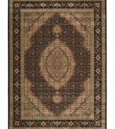 Distinctive flair with roots in Persian design. This exquisitely ornate area rug is abound in deep, striking black and beige tones, highlighted by a dramatic central medallion, and crafted from Nourison's own Opulon(tm) yarns for a densely woven pile with long-lasting color retention and durability.