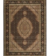 Distinctive flair with roots in Persian design. This exquisitely ornate area rug is abound in deep, striking black and beige tones, highlighted by a dramatic central medallion, and crafted from Nourison's own Opulon(tm) yarns for a densely woven pile with long-lasting color retention and durability.