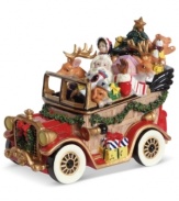Full or surprises, St. Nick hits the road, piling Donner and Blitzen, teddy bears and toy planes into a classic car from Fitz and Floyd.