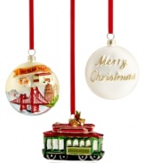 Keep San Francisco in sight all season long. An iconic cable car adorned with glitter and bells and an ornament featuring much-loved landmarks evoke the city by the bay. Disk ornament shown front and back.