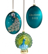 Peacock-theme beauty adorns your tree in these two ornaments, featuring intricate designs and shimmering sparkles. Oval ornament is shown front and back and reads: Christmas 2012.