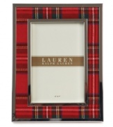 Bring great memories to the forefront with the Clearly Tartan picture frame. Classic red plaid edged in silver plate trims your decor with the traditional prep and polish of Lauren Ralph Lauren.