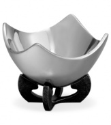 Set or simply decorate the table with the ultra-modern Anvil Scroll bowl from Nambe. A sculptural, iron-finished base cradles contoured silvertone alloy in this innovative Neil Cohen design.