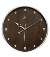 Make time for style with this handsome wall clock. A round wood grain dial with silver hour markers and metal hands adds contemporary flair to any room.