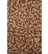 Teeming with a thousand tiny taupe dots, this area rug from Liora Manne is a celebration of stylish restraint. Its richly textured surface that is created through intricate hand carving, offering a pom-pom motif in muted, organic hues for an inspiring addition to your decor.