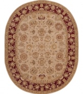 A deep maroon border offers a refreshing pop of color on this sophisticated area rug. Meticulously handcrafted with soft wool pile, and highlighted with lustrous silk accents, this elegant addition to the Nourison 2000 collection lends a fashionable look to both casual and refined spaces.