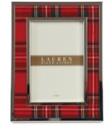 Bring great memories to the forefront with the Clearly Tartan picture frame. Classic red plaid edged in silver plate trims your decor with the traditional prep and polish of Lauren Ralph Lauren.