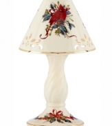 Ever so bright, the Winter Greetings candle lamp by Lenox combines everything that's beautiful about the season in pierced ivory porcelain with radiant gold trim.