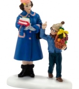 Ralphie tries his hand at bribery, presenting Miss Shields with an entire fruit basket instead of an apple in this humorous figurine from A Christmas Story Village. By Department 56.