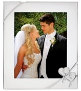 Preserve a cherished moment of your own or treat your favorite newlyweds to the True Love picture frame. Interlocking hearts adorn elegant silver plate, a beautiful showcase for wedding or honeymoon photos. Qualifies for Rebate