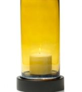 Give your home a golden touch. Sunny yellow glass amplifies the warm glow from inside the Solaris hurricane candle holder from Mikasa.