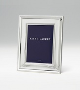 Poised and polished silverplate surrounds your photos in quiet elegance. Black fabric backingAnti-tarnish finishSilver-plated RL closureSignature gift boxAvailable in 4 X 6 or 5 X 7 Imported
