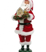 Santa Claus can't help but carol as he presents Mrs. Claus with a handcrafted gingerbread house from Byers' Choice. Dressed in his holiday best – red velvet, of course! – he's the picture of holiday cheer.
