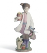 Grow your Lladro collection with the charming Delicate Nature figurine. A young girl gets to work outside, potting plants and feeding the birds.