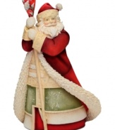 Spread the love this holiday season. This figurine stands tall on any table or mantle as Santa Claus, in traditional robe and hat, holds a heart-shaped staff. With crystal accents.