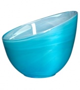 Electrify your home with the eye-catching Candy Blue collection from Sea Glasbruk. Caribbean blues swirl and wrap the minimalist glass bowl in a sweet celebration of color. With an askew rim and slick, glazed finish.
