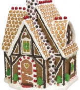 A gingerbread house that'll never get stale. Cemented with white frosting and studded with colorful candies and black licorice trim, it's a place for all the sweet-toothed Byers' Choice kindles to gather.