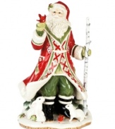 Rabbits, cardinals and other gentle creatures come out to greet Santa, gathering at his feet in this beautifully crafted figurine from Fitz and Floyd.