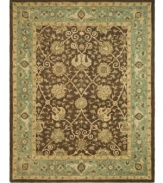 Alluring arabesques weave an inspiring design on this earth-toned area rug from Safavieh. Tufted in India from pure wool, this rug emerges from the annals of antiquity to bring spectacular style and time-honored quality to your home. (Clearance)