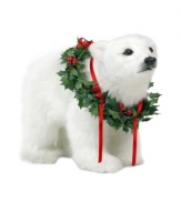 It's the holiday season, why not look your best? This playful polar bear cub celebrates this joyful time of year by donning a decorative wreath of holly, ivy and festive red ribbons.