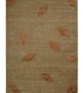 Exquisitely chic with an alluring foliage motif, this area rug is hand tufted and hand carved from only the finest premium wool. Set against a walnut-hued ground, it's expertly washed to lend the surface a handsome luster, texture and sheen.